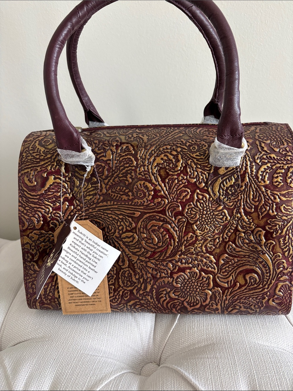 SUKRITI hand painted leather satchel with embossed design NWT